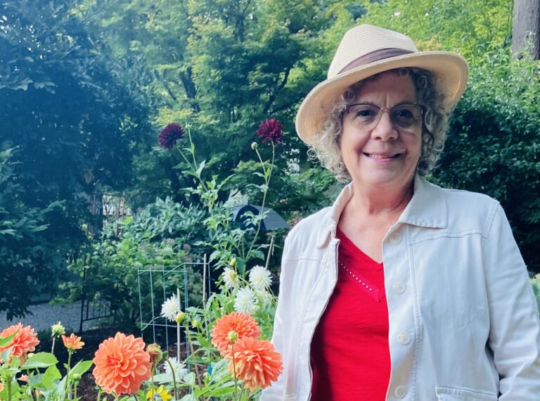 GPC Legacy Member Margie Esola stands in her garden